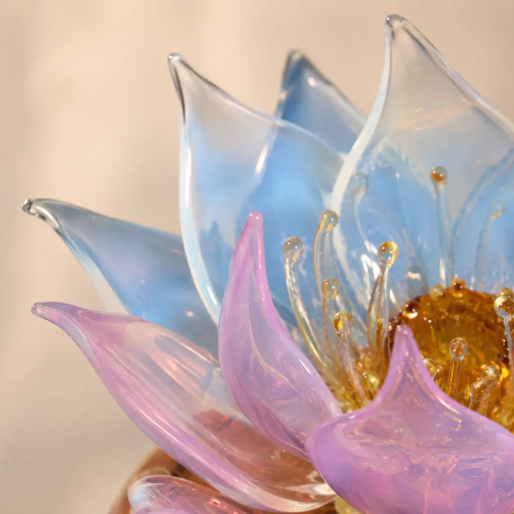 Aurora Lotus balanced glass lotus light with soft blue-white and lavender translucent petals and amber glass stamen details