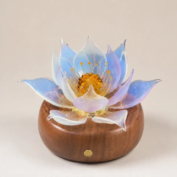 Aurora Lotus Balanced Glass Lotus Light Aurora Lotus balanced glass lotus light with soft blue-white and lavender petals on a warm walnut wood base
