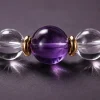 Water Flow bracelet macro detail with clear quartz beads, purple amethyst center bead, and gold-plated spacers