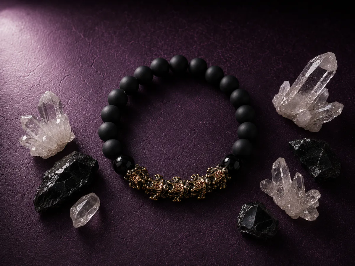 Premium black obsidian bracelet showcasing high-density natural mineral beads staged with deep chiaroscuro lighting shadows