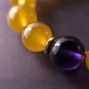 Earth Ground Yellow Agate Amethyst Bracelet Macro Detail Earth Ground bracelet macro detail with yellow agate beads, purple amethyst center bead, and gold-plated spacers