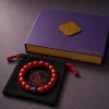 Fire Radiance bracelet with Nanhong agate beads, purple amethyst center bead, purple 9Purple gift box, and black drawstring pouch
