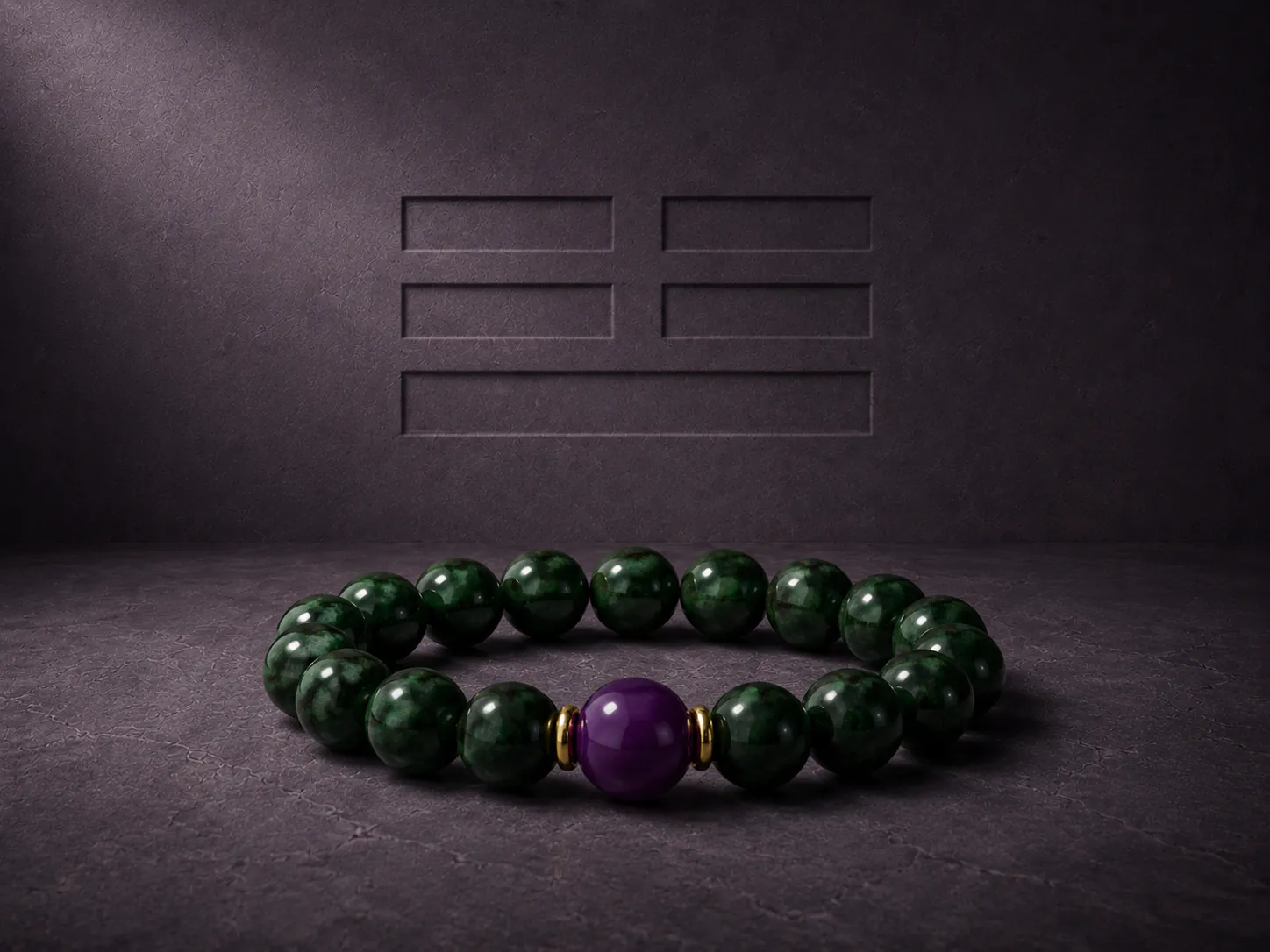 Premium five elements gemstone bracelet featuring curated green jadeite and deep stone textures staged on a brutalist slab with deep chiaroscuro window shadows