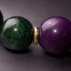 Wood Renewal Ganqing Jade Amethyst Bracelet Macro Detail Wood Renewal bracelet macro detail with Ganqing jade beads, purple amethyst center bead, and gold-plated spacers