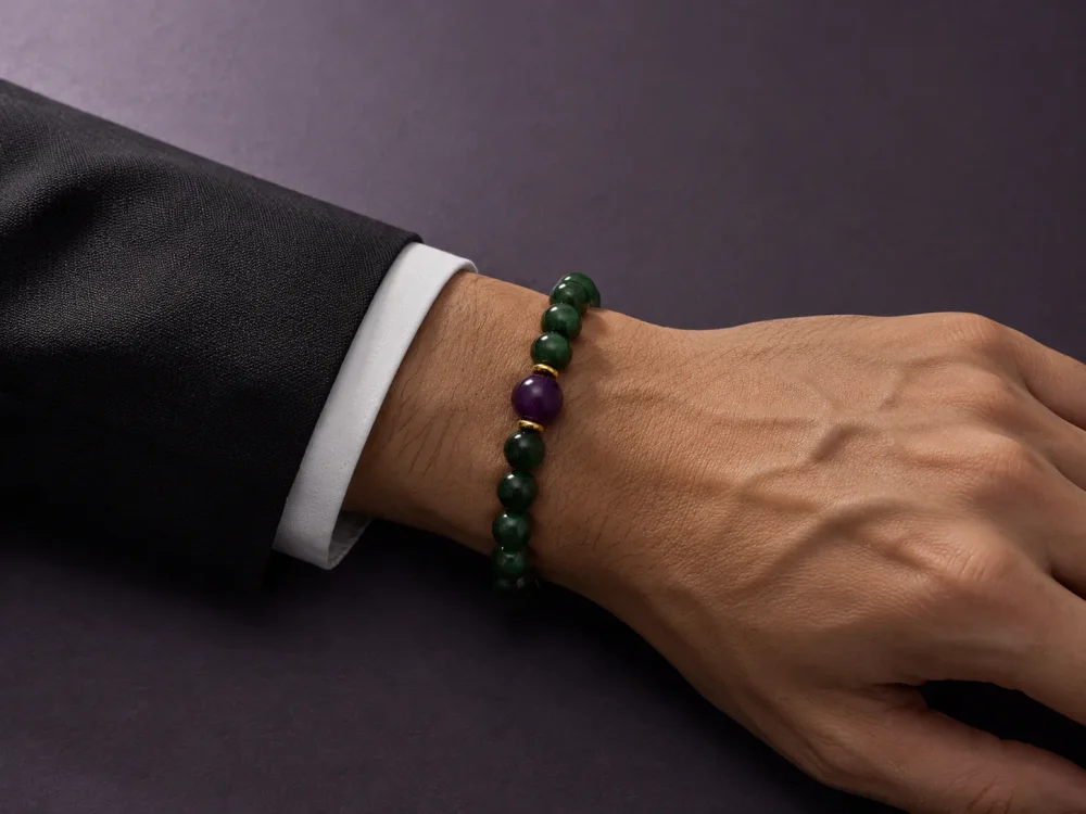 Wood Renewal Ganqing Jade Amethyst Bracelet Male Wrist Shot Wood Renewal bracelet worn on male wrist with Ganqing jade beads, purple amethyst center bead, and gold-plated spacers