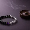 A stylized close-up of the 9Purple branding text and Period 9 Energy Object engraving on the luxurious packaging element.