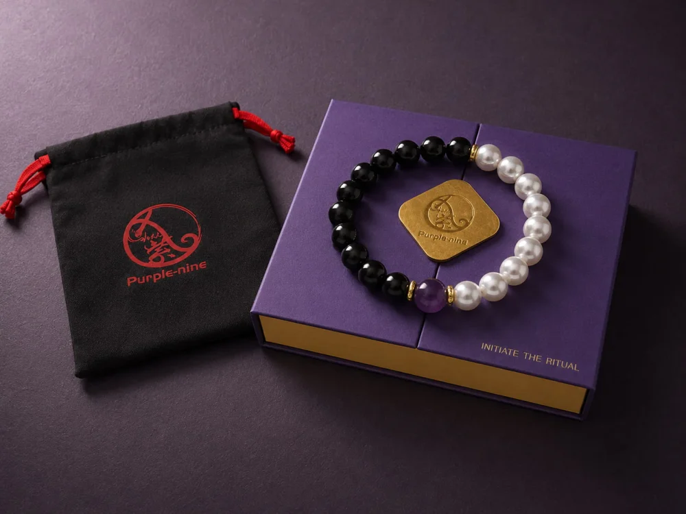 Open 9Purple signature matte-black rigid square gift box revealing custom protective velvet lining and the bracelet.