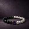 9Purple luxury Yin-Yang bracelet featuring black cat's eye obsidian, lustrous natural pearl, and 18k gold-filled spacer beads.