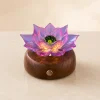 Rosefire Lotus rose-toned glass lotus light with magenta petals and an emerald glass center on a warm walnut wood base