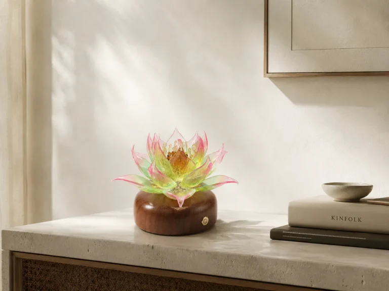 Glass lotus decor placed in a calm modern interior with soft natural light