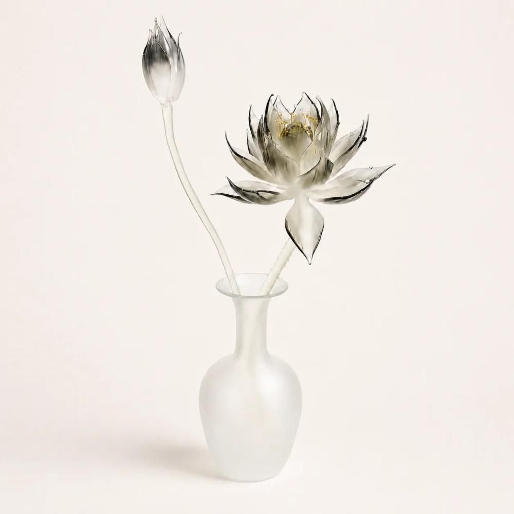 Lunar Lotus Studio Glass Vase Object Hero Image Lunar Lotus Studio Glass Vase Object with smoky glass lotus bloom, closed bud, curved stems, and frosted white vase